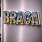 Braga souvenir magnet with historic churches, monuments and tile-inspired decorative patterns placed on a fridge