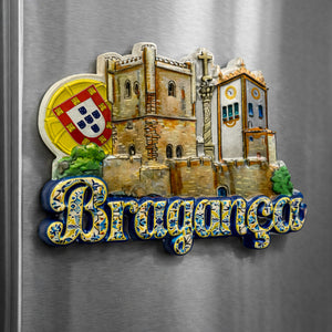 Bragança Portugal souvenir magnet placed on a fridge featuring the castle, Domus Municipalis, historic walls, church architecture, and Portuguese coat of arms