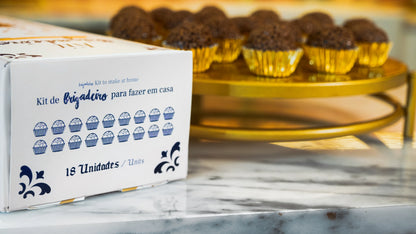 Portugal brigadeiro cooking kit box with finished chocolate brigadeiros in golden paper cups