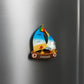 Decorative magnet of a sailboat with a bird on a metallic surface