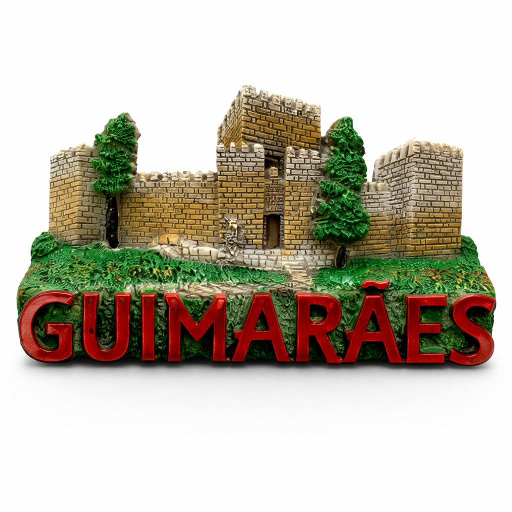 Guimarães Portugal souvenir magnet featuring a medieval stone castle, historic walls, green landscape details, and raised lettering
