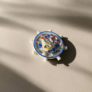 Faro Souvenir Magnet – Nautical Ship Wheel with Sailboat and Marine Ornaments