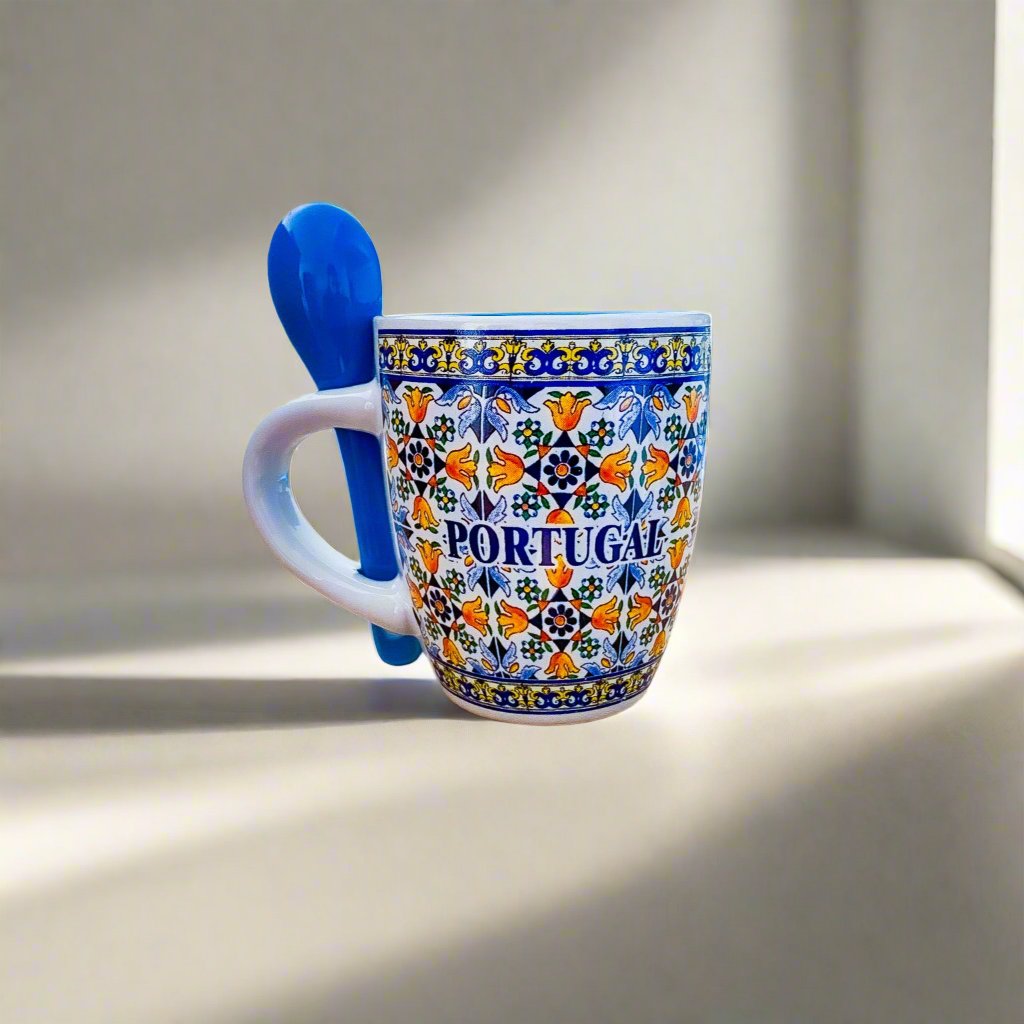 A beautifully designed ceramic coffee cup adorned with blue and white patterns, a delightful souvenir from Portugal.
