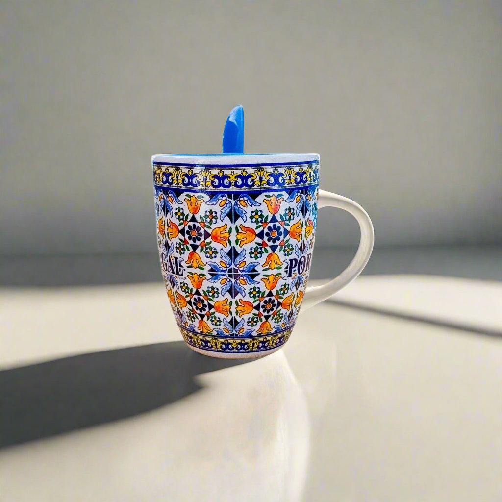 A blue and white patterned ceramic coffee cup, serving as a lovely souvenir from Portugal.