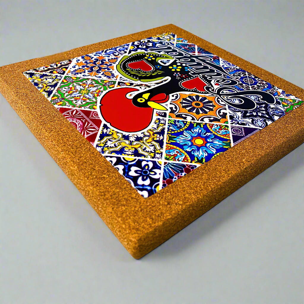 Colorful mosaic artwork with a red circle and geometric patterns on a cork board.
