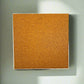 Square cork bulletin board on a white wall