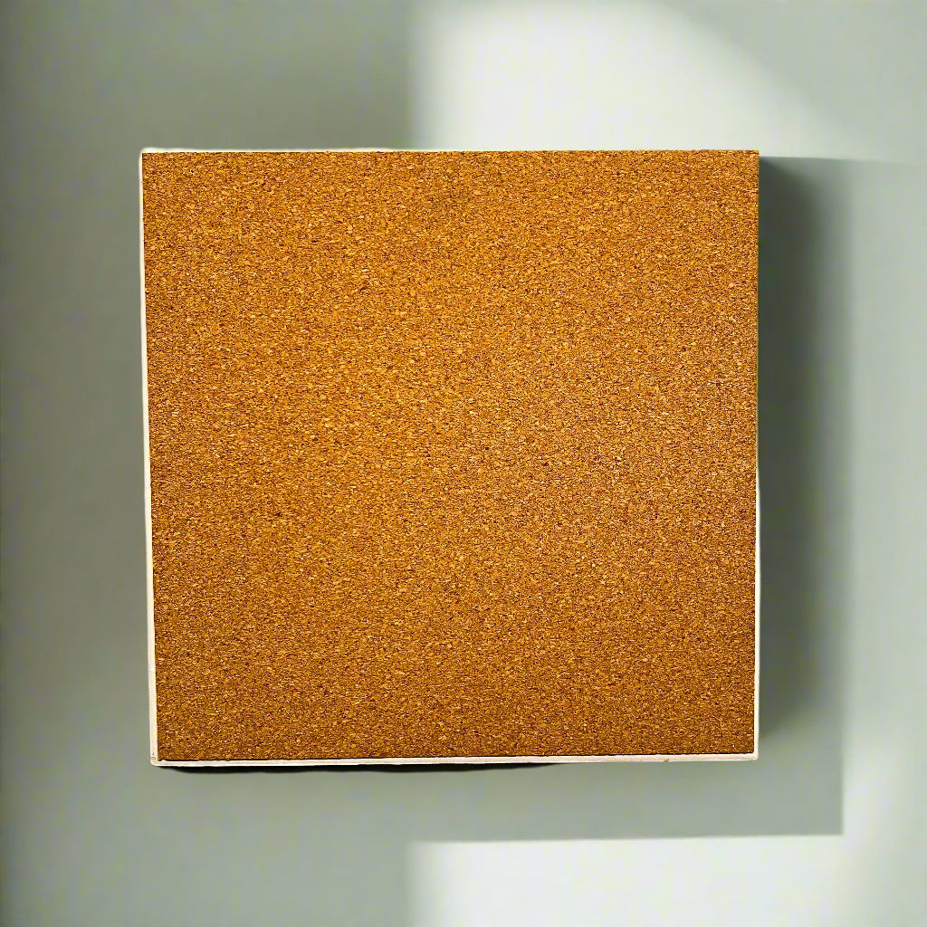 Square cork bulletin board on a white wall
