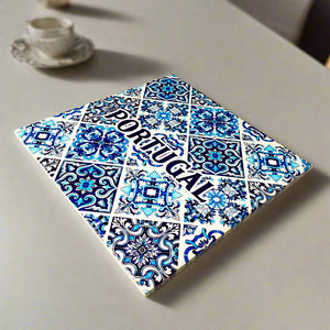 Decorative tile with Portuguese design and 'Portugal' text on a beige surface