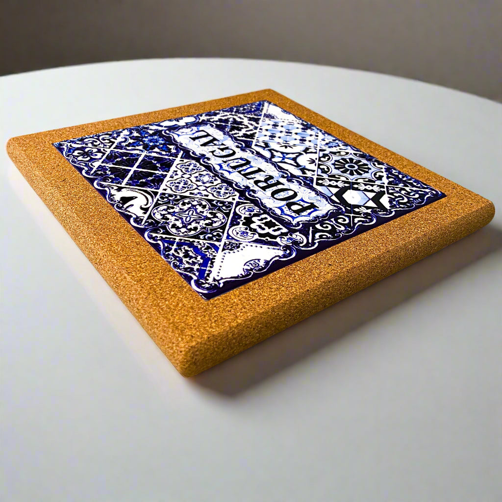 Cork coaster with blue and white pattern on a white surface