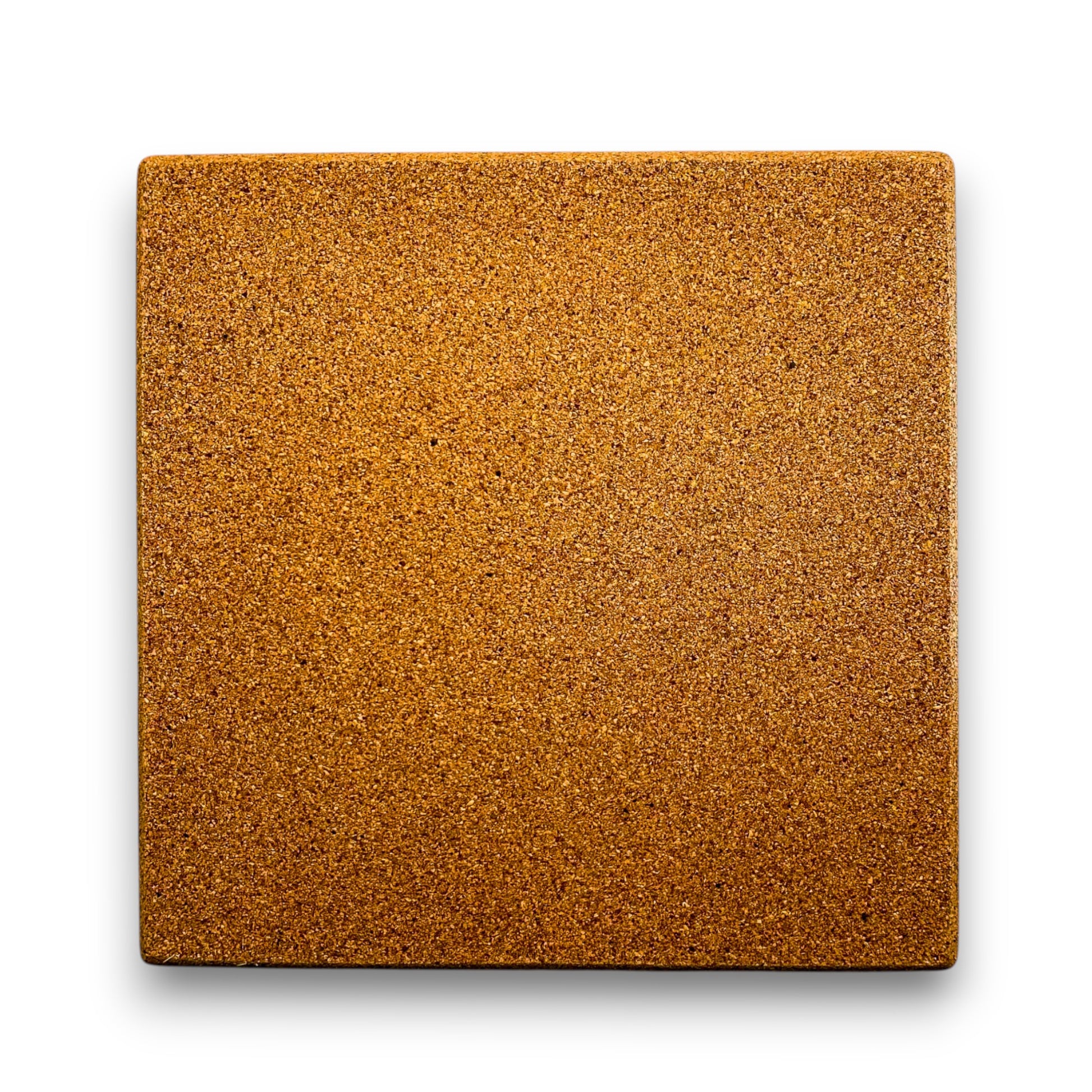 Side view of cork trivet with vibrant Portuguese ceramic tile