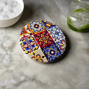 Round decorative plate with colorful pattern on a plain background
