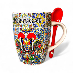 Colorful mug with 'Portugal' text and decorative patterns, accompanied by a red spoon.