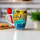 Colorful mug with a design and the word 'Algarve' on a white surface.