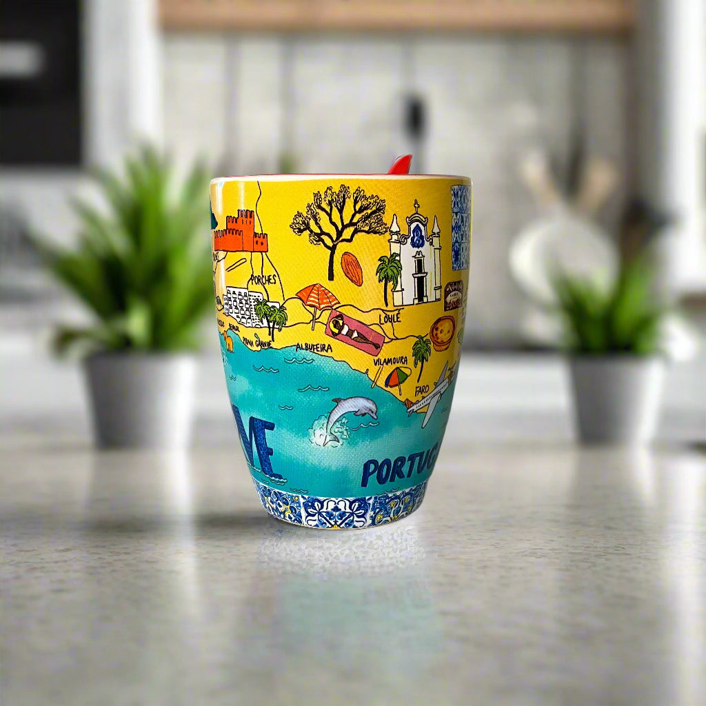 Colorful cup with Portuguese-themed design on a plain background