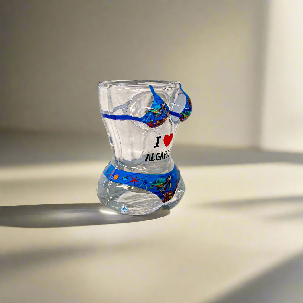 Clear glass with blue accents and 'I love algae' text on a white surface