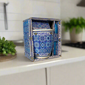 Decorative ceramic container with blue and white pattern and 'Portugal' text, placed inside a matching box.