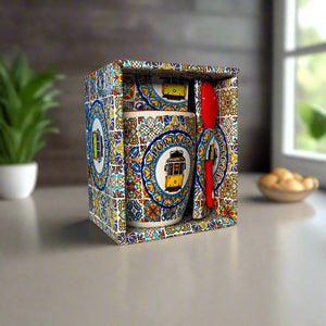 Decorative box with colorful mosaic design on a table