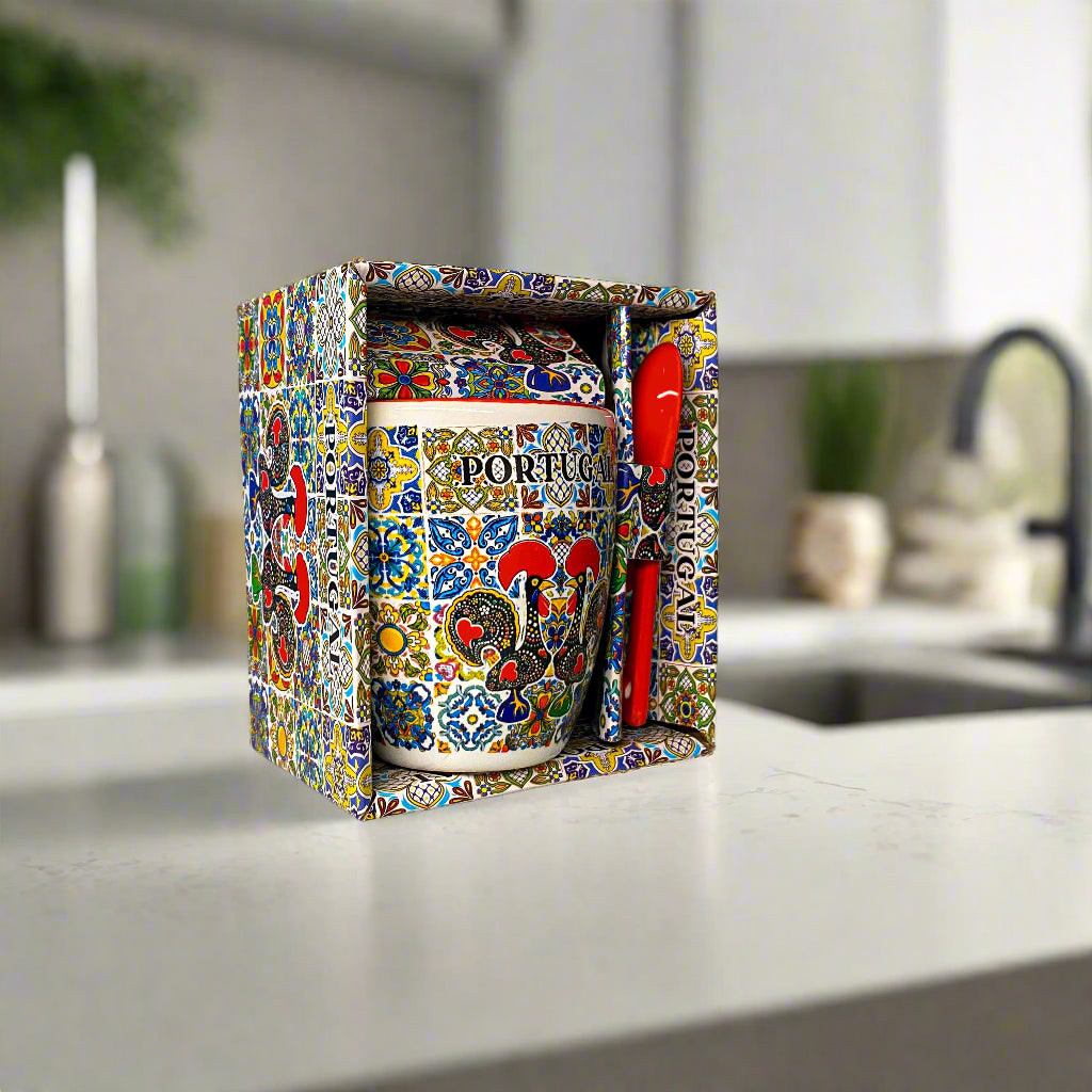 Decorative mug with colorful patterns and 'Portugal' text in a matching box on a light background