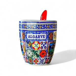Decorative coffee cup with colorful patterns and 'Algarve' text on a white background