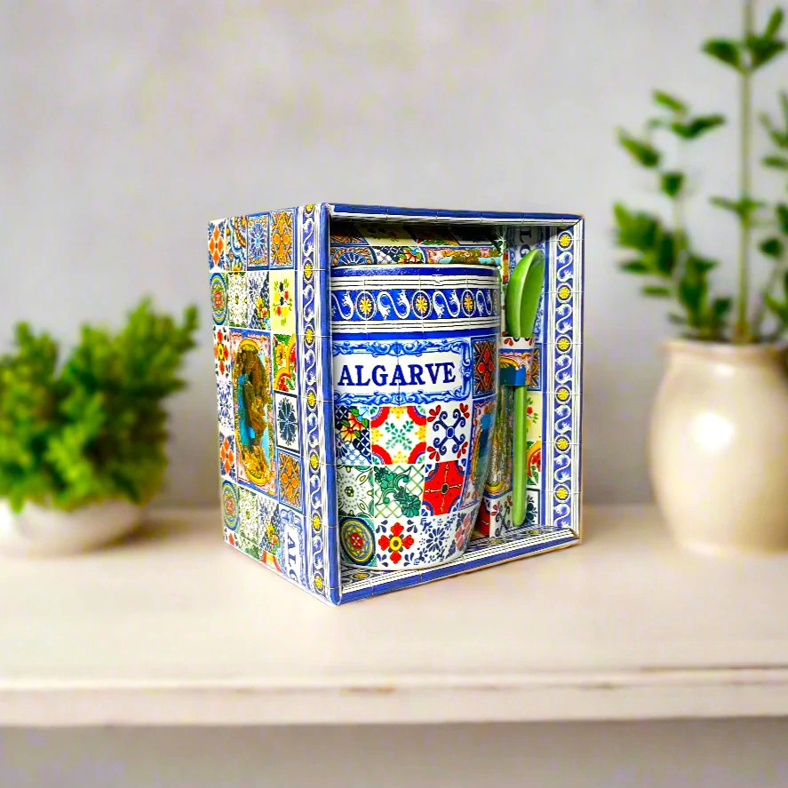 A boxed set of Algarve-themed mugs, featuring traditional Portuguese designs and vibrant colors. The set comes with a green spoon, making it a charming and functional souvenir from Portugal.