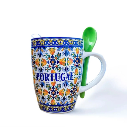 A floral tile mug with a spoon, showcasing Portuguese artistry, perfect for coffee or as a decorative piece.