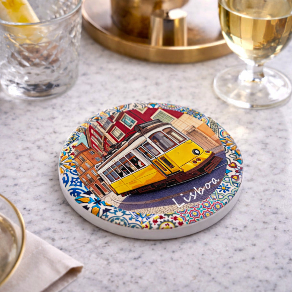 Angled view of Lisbon souvenir coaster showing tram illustration and colorful azulejos pattern