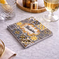 Madeira souvenir square coaster with azulejos design placed on table with drinks in elegant setting