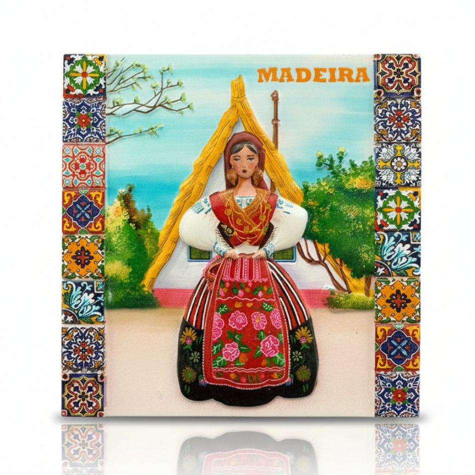 Madeira souvenir magnet featuring a traditional Madeiran woman in regional costume with decorative tile-style frame