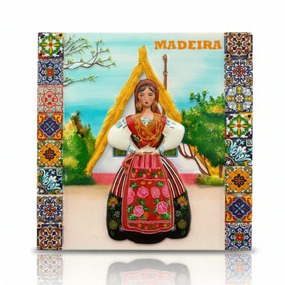 Madeira souvenir magnet featuring a traditional Madeiran woman in regional costume with decorative tile-style frame