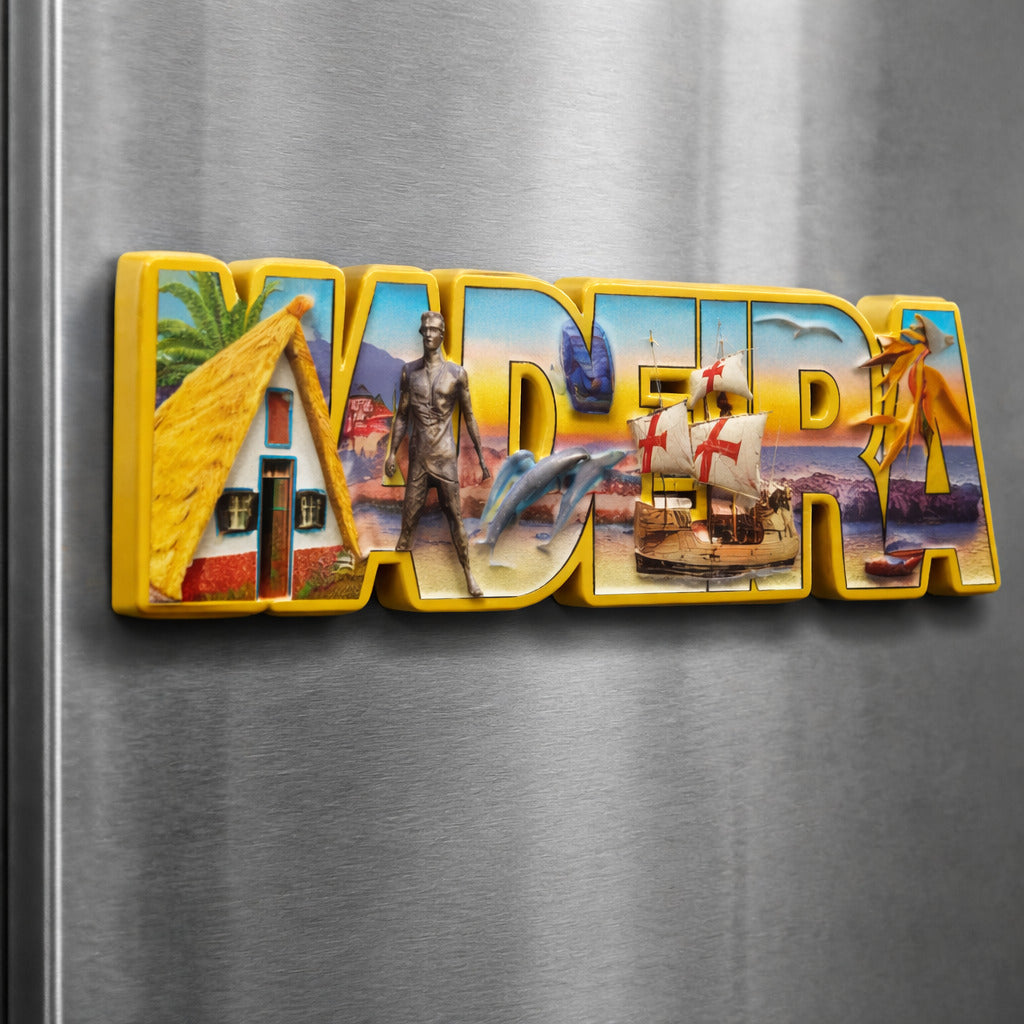 Madeira souvenir magnet placed on a fridge with typographic design featuring traditional house, maritime ship, island monuments, and coastal scenery in Portugal