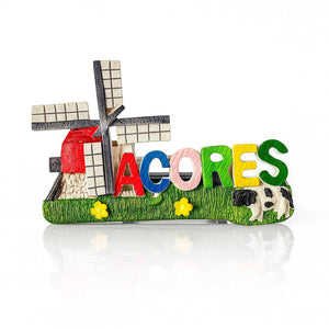 A colorful fridge magnet featuring the word 'Açores' with a traditional windmill, a cow, and floral elements.