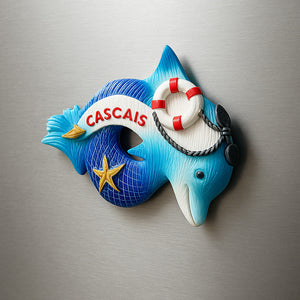 Decorative fish-shaped object with 'Cascais' text on a metallic background