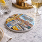 Porto souvenir ceramic coaster in use with drinks on a marble table in an elegant setting