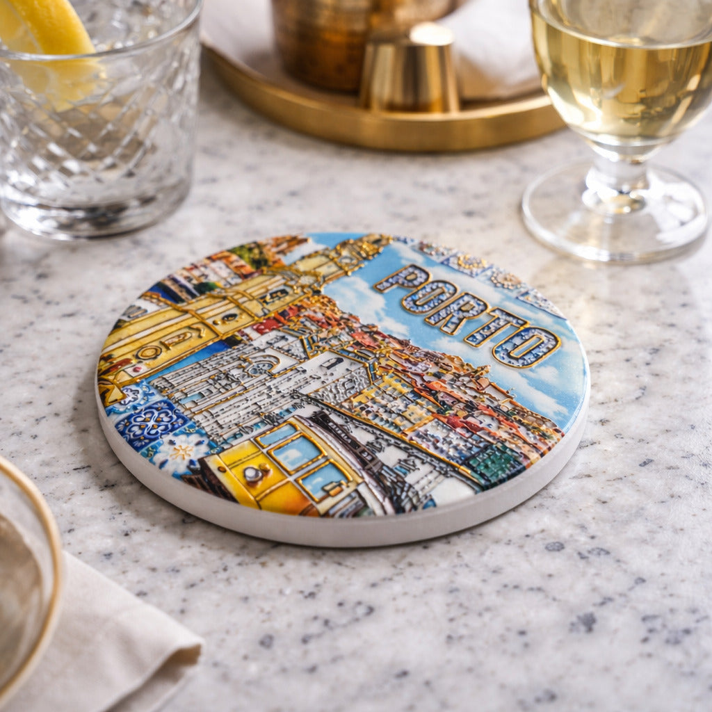 Porto souvenir ceramic coaster in use with drinks on a marble table in an elegant setting