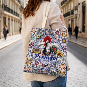 Portugal cotton tote bag souvenir with Barcelos rooster, Lisbon tram and azulejos tile pattern carried in Lisbon street.