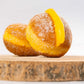 Close-up of traditional Portugal Bola de Berlim filled with egg cream and coated in sugar