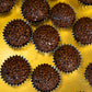 Close-up of traditional Portugal brigadeiro chocolate truffles with chocolate sprinkles in paper molds