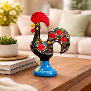 Traditional Portuguese Galo de Barcelos ceramic rooster decorative souvenir displayed on a table in a living room