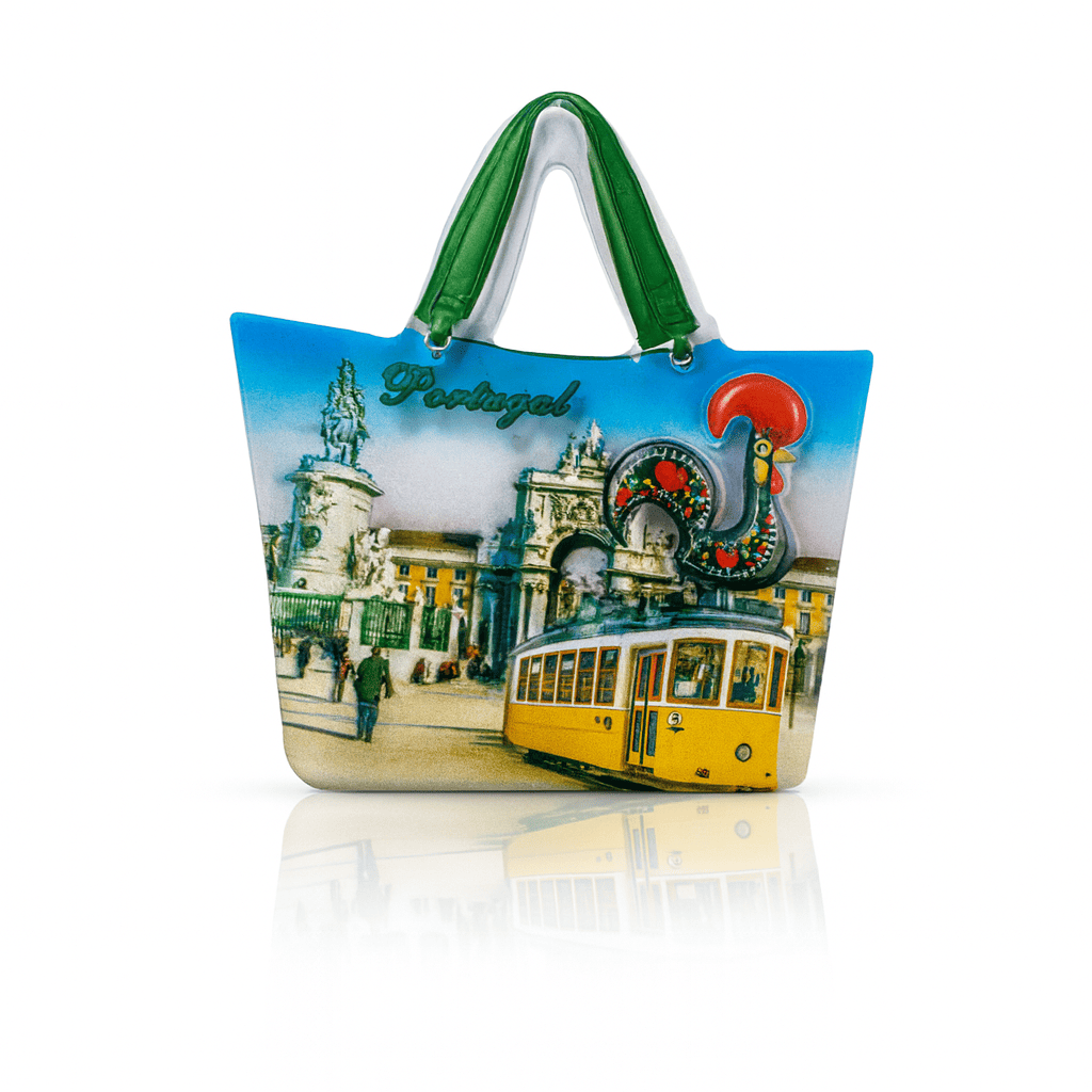 Magnet shaped like a shopping bag featuring Lisbon’s Praça do Comércio, yellow tram, the Barcelos rooster, and the word “Portugal” above in green text