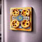 Portugal souvenir magnet featuring four pastel de nata with traditional tile-inspired background placed on a fridge