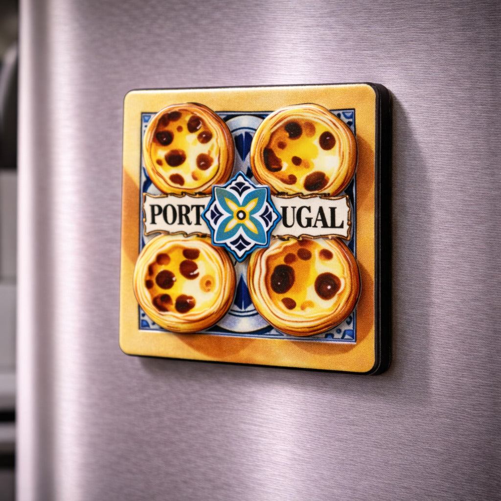 Portugal souvenir magnet featuring four pastel de nata with traditional tile-inspired background placed on a fridge