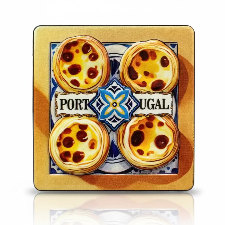 Portugal souvenir magnet featuring four pastel de nata with traditional tile-inspired background