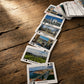 Portuguese souvenir card deck arranged in a long display, with each playing card featuring a different city, region, monument, or cultural attraction in Portugal.