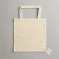 Beige tote bag on a gray background