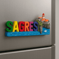 Colorful 'SAGRES' magnet with a lighthouse and cliffs on a metallic surface