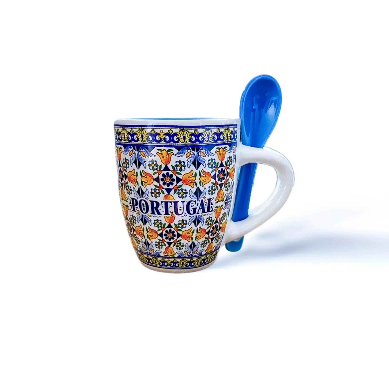 A ceramic coffee cup featuring a blue and white patterned design, showcasing a souvenir from Portugal.