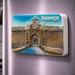 Valença souvenir magnet placed on a fridge with illustrated historic fortress gate and stone walls