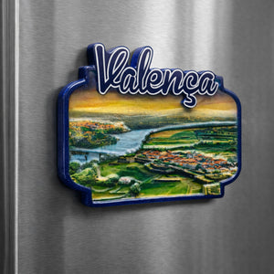 Valença Portugal souvenir magnet placed on a fridge featuring a panoramic river landscape, green fields, and the historic town with red-tiled rooftops