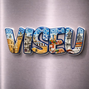 Viseu souvenir magnet with historic buildings, churches and tile-inspired decorative patterns placed on a fridge